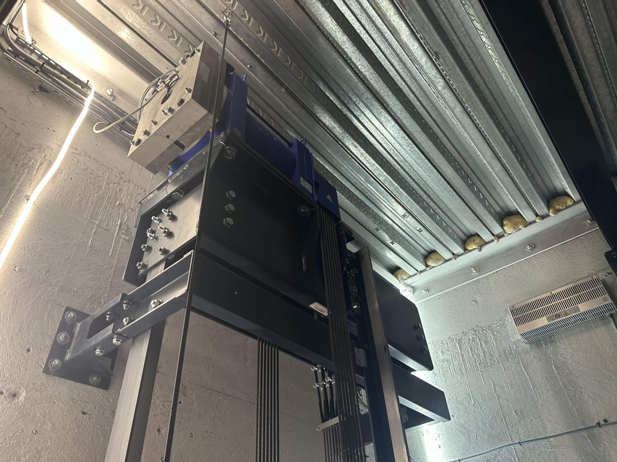 a metal structure with a blue object