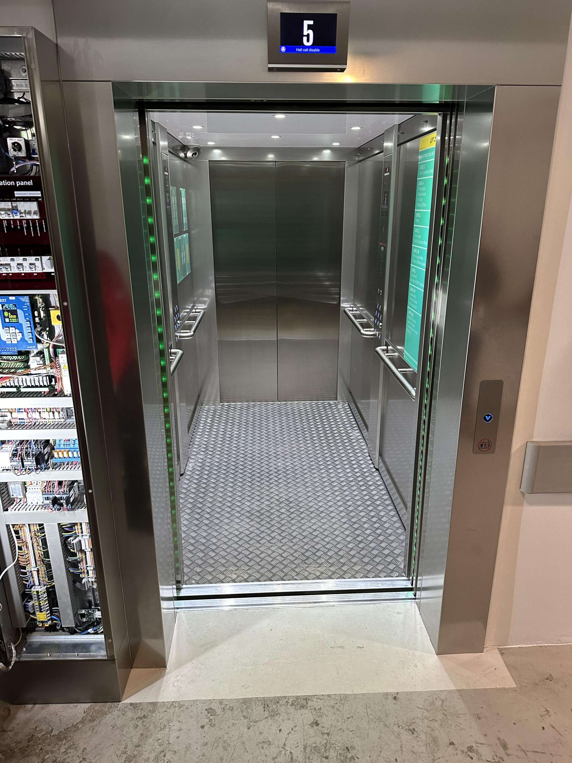 an elevator with glass doors