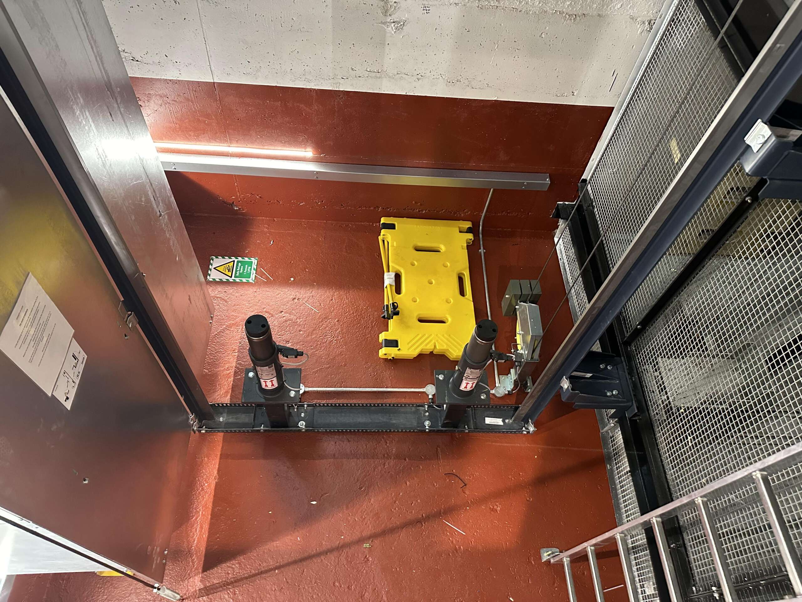 a yellow plastic container in a room