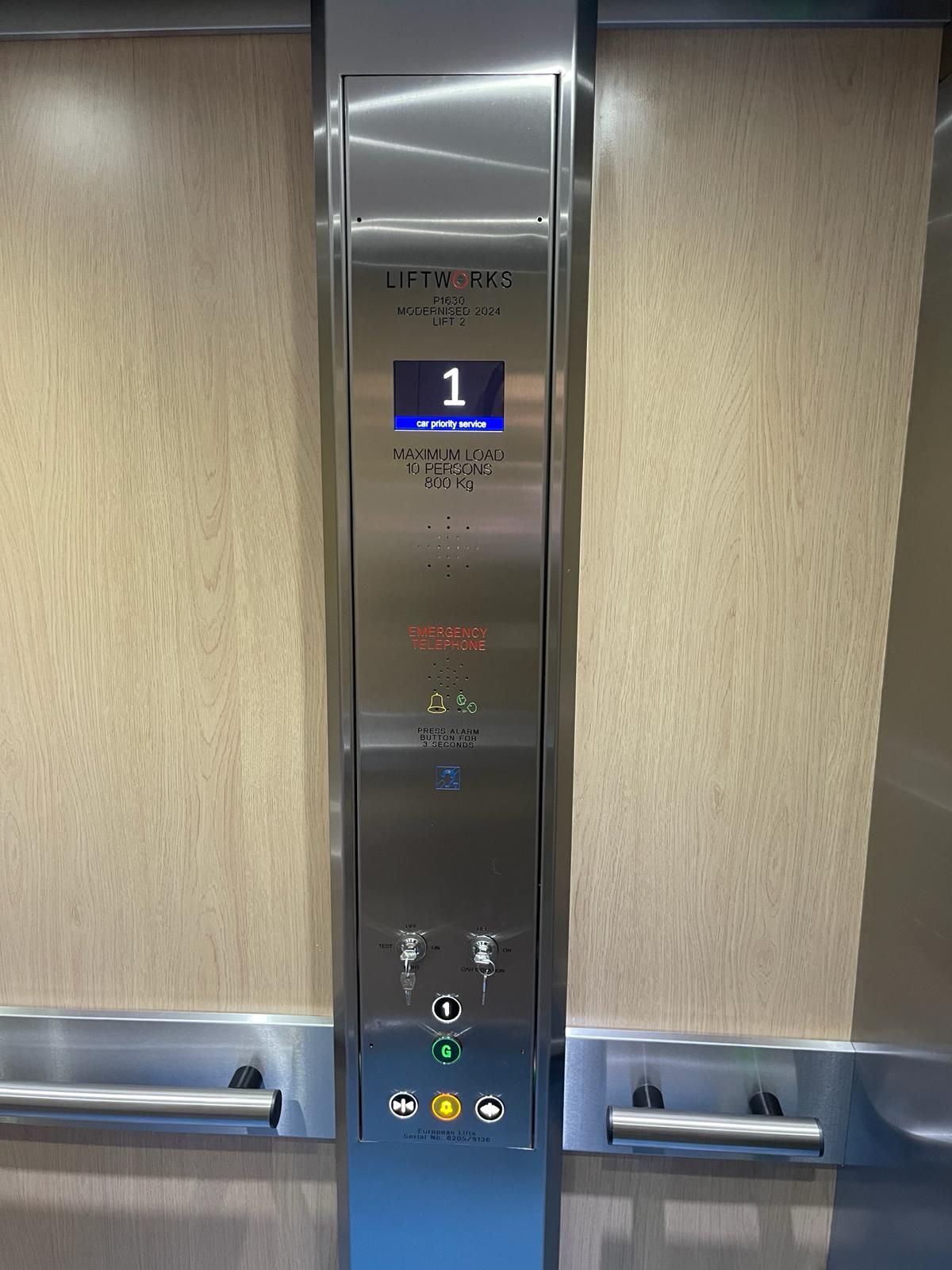 a elevator with buttons and switches