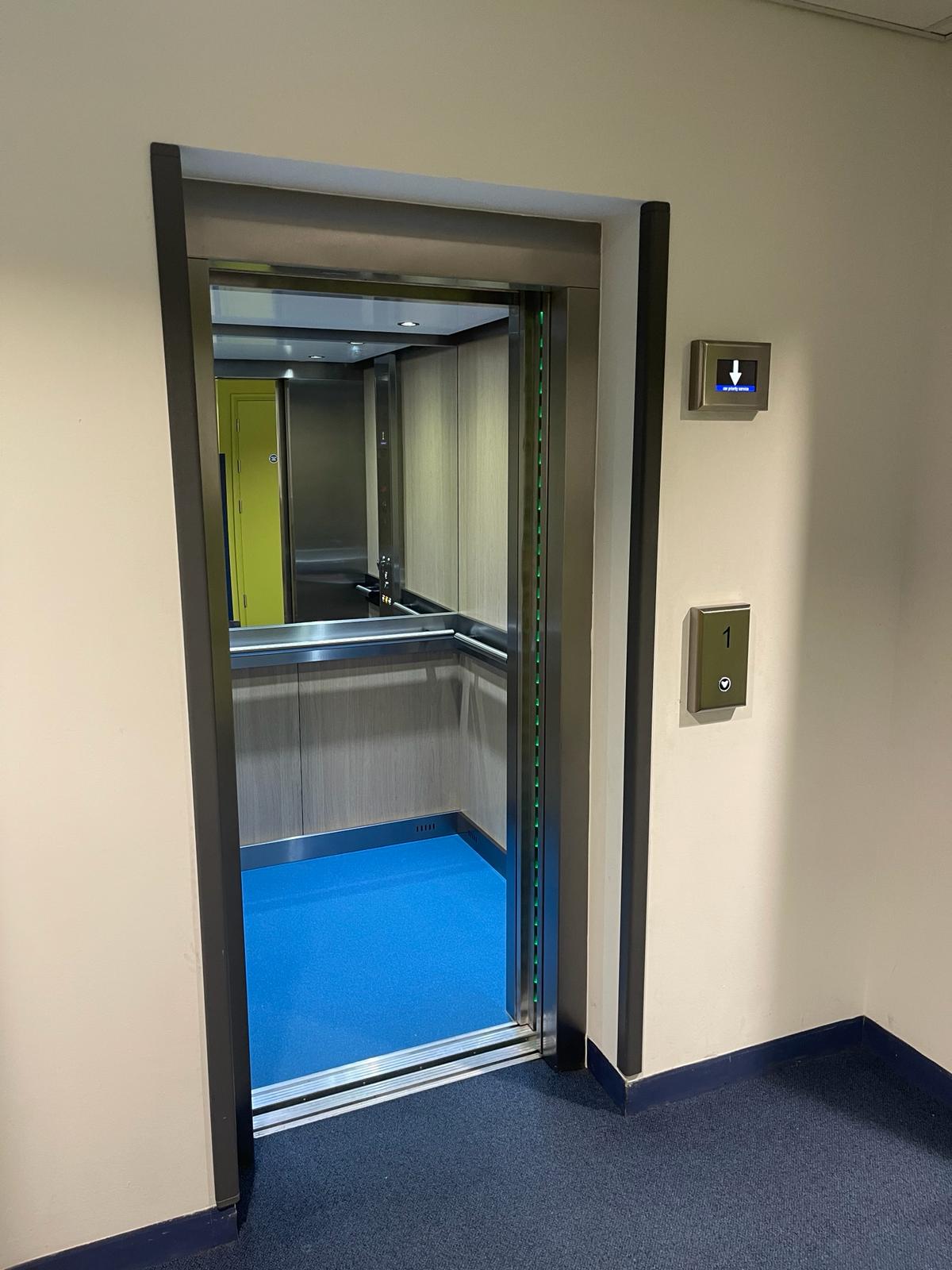 an elevator with a blue floor