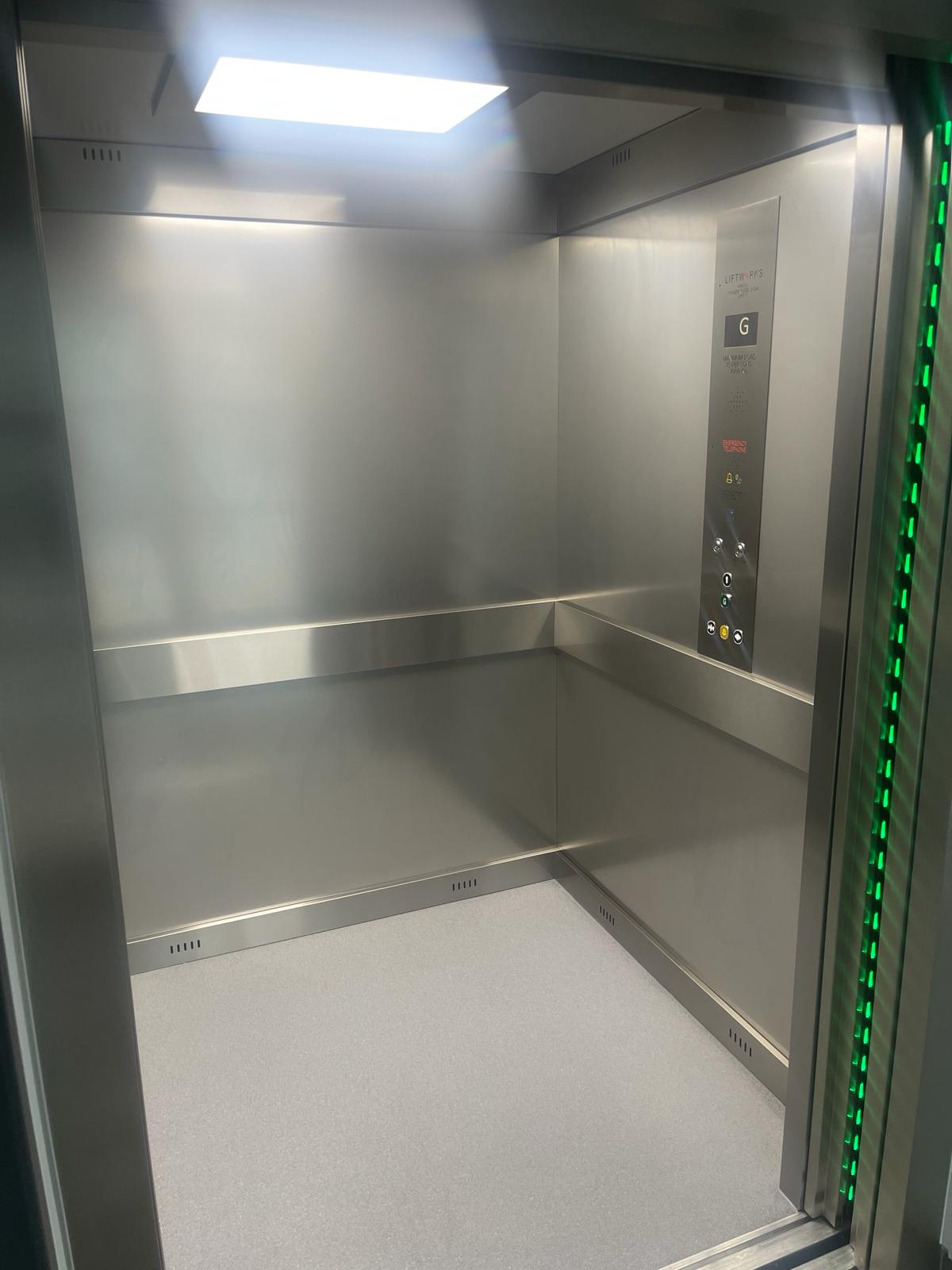 an elevator with a green light