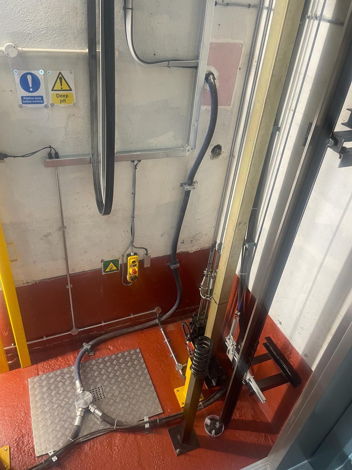 a machine with pipes and hoses